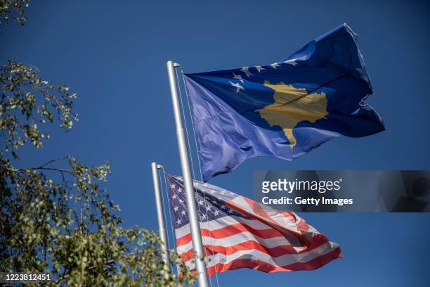 June 30, 2020: Kosovo and American flags wave in city center on June 29, 2020 in Pristina, Kosovo. President Hashim Thaci, who was the former...