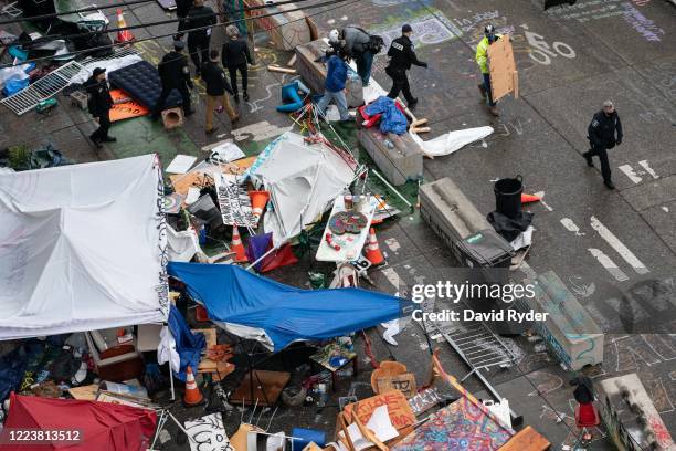 City crews dismantle the Capitol Hill Organized Protest area outside of the Seattle Police Department's vacated East Precinct on July 1, 2020 in...