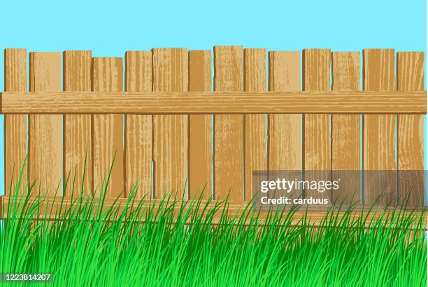 old fence in the grass - palisade boundary stock illustrations