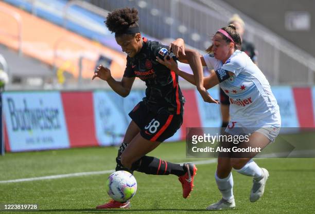 Simone Charley of Portland Thorns FC fights for the ball with Julia Bingham of Chicago Red Stars during a game in the first round of the NWSL...