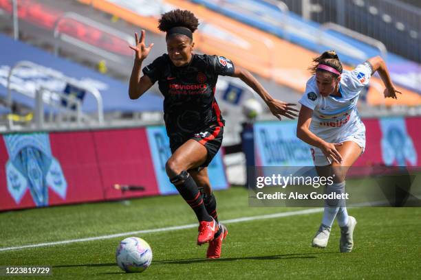 Simone Charley of Portland Thorns FC fights for the ball with Julia Bingham of Chicago Red Stars during a game in the first round of the NWSL...