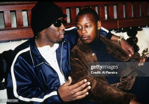 Hip-Hop Producer/Executive/Label Head Andre Harrell relaxes in a nightclub VIP area by chatting with Sean "Puffy" Combs on November 12, 1994 in New...