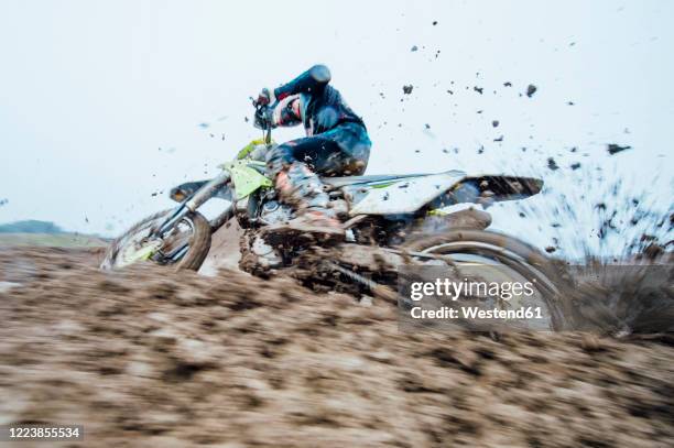 motocross driver during motocross race - scrambling fotografías e imágenes de stock