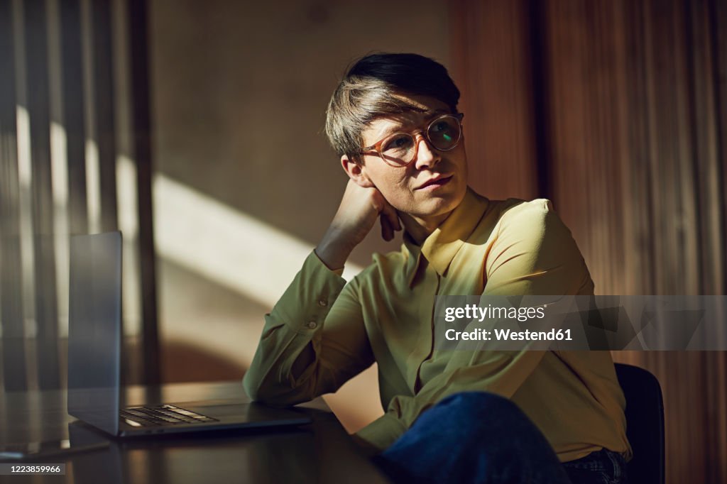 Businesswoman sitting in her sustainable office, portrait