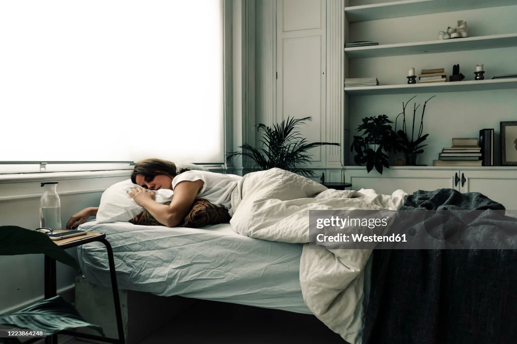 Woman sleeping in bed