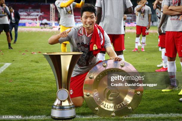 Hee Chan Hwang of Salzburg celebrates with the austrian soccer championships and austian cup trophy prior the tipico Bundesliga match between Red...