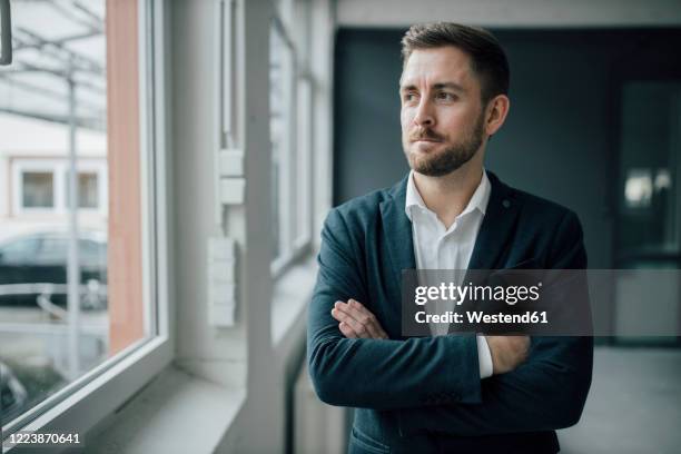 portrait of brunette businessman - man short hair stock pictures, royalty-free photos & images