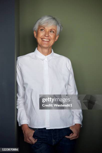 portrait of smiling senior businesswoman wearing white shirt - grey blouse stock pictures, royalty-free photos & images