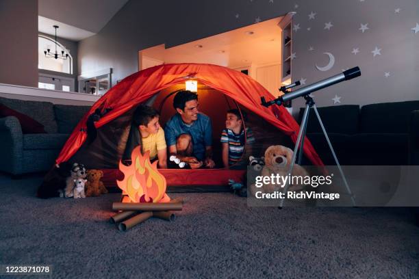 father and sons camping indoors - staycation stock pictures, royalty-free photos & images