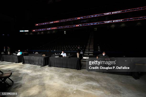 Members of the media use their computers ring side during UFC 249 at VyStar Veterans Memorial Arena on May 09, 2020 in Jacksonville, Florida.