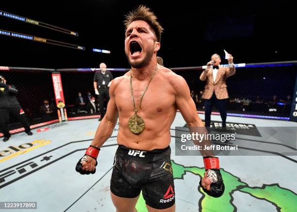 Henry Cejudo celebrates after his knockout victory over Dominick Cruz in their UFC bantamweight championship fight during the UFC 249 event at VyStar...