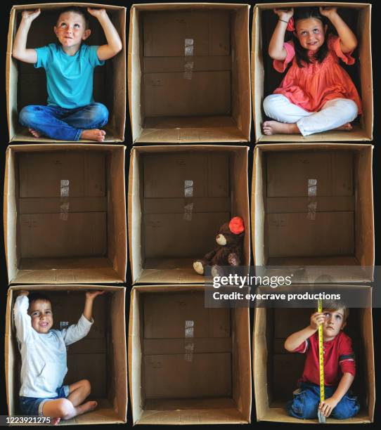 feeling isolated from society small children inside enclosure series involving cardboard box related to shelter in place during illness crisis - confined space stock pictures, royalty-free photos & images