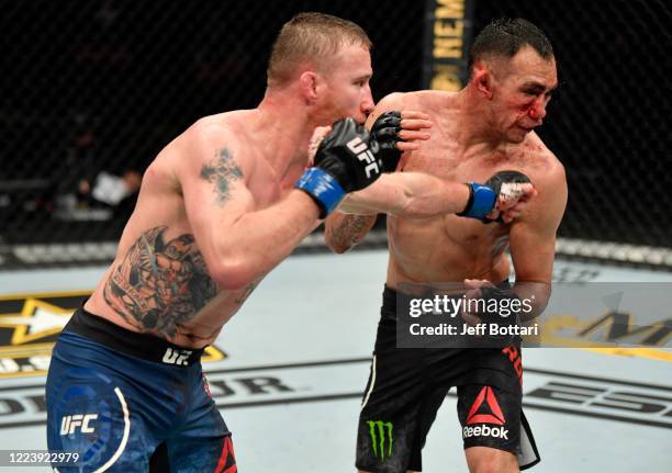 Justin Gaethje punches Tony Ferguson in their UFC interim lightweight championship fight during the UFC 249 event at VyStar Veterans Memorial Arena...