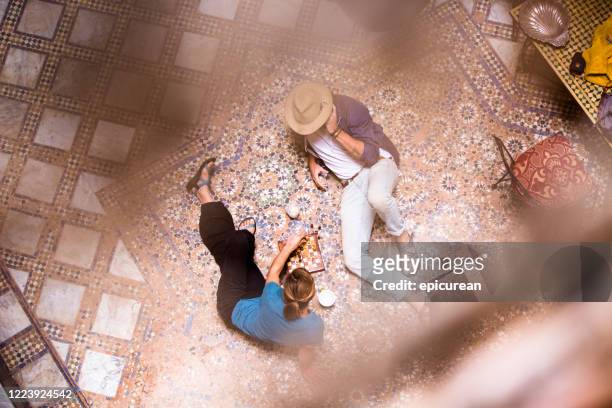 happy american couple enjoying vacation in fez morocco - moroccan tile stock pictures, royalty-free photos & images