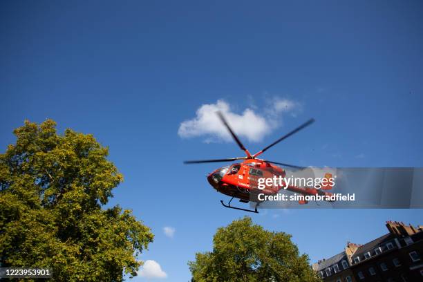 air ambulance taking off in london - air ambulance stock pictures, royalty-free photos & images