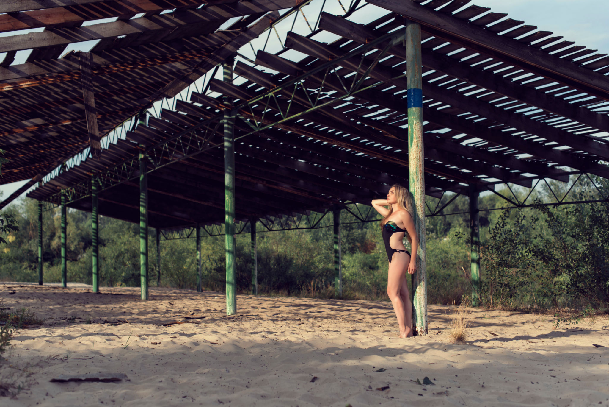Walking along the beach with a woman in a swimsuit Walking along the beach with a woman in a swimsuit