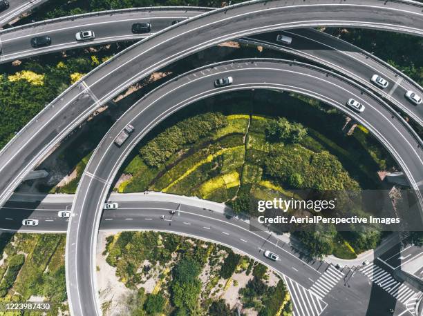 drone view of road intersection - crosswalk stock-fotos und bilder