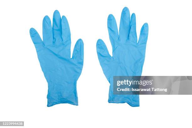 pair of latex medical gloves isolated on white background. protection concept - handschoen stockfoto's en -beelden