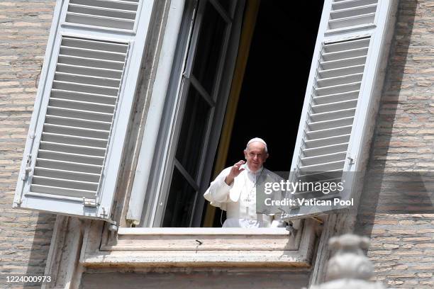 Pope Francis delivers his Sunday Angelus blessing from the window of his private library overlooking an empty St. Peter's Square due to Coronavirus...