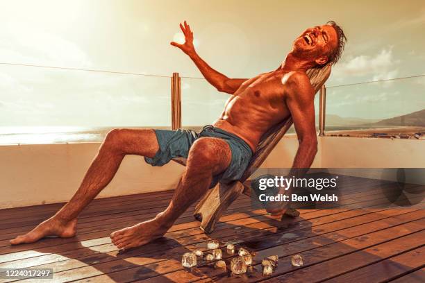 man getting a sun burn - sun burn stock pictures, royalty-free photos & images