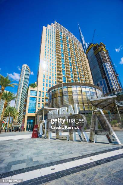 sign #dubai opera near the opera house - dubai opera stock pictures, royalty-free photos & images