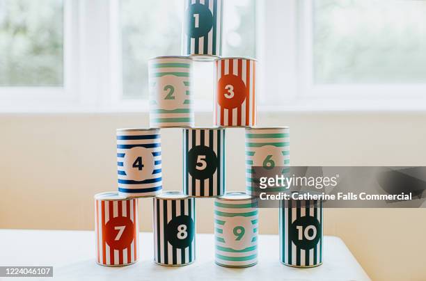 stacked cans - pyramid shapes around the house stock-fotos und bilder