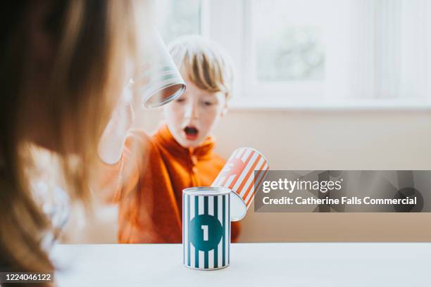 stacking cans - falling house of cards stock pictures, royalty-free photos & images