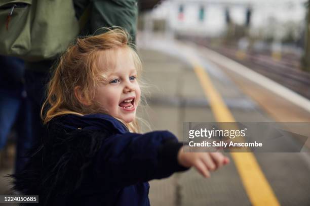 child stood on a platform pointing - girl pointing bildbanksfoton och bilder
