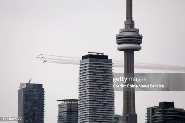 Canadian Forces Snowbirds fly over Toronto during the Operation Inspiration cross-country tour to salute Canadians for fighting against the COVID-19...