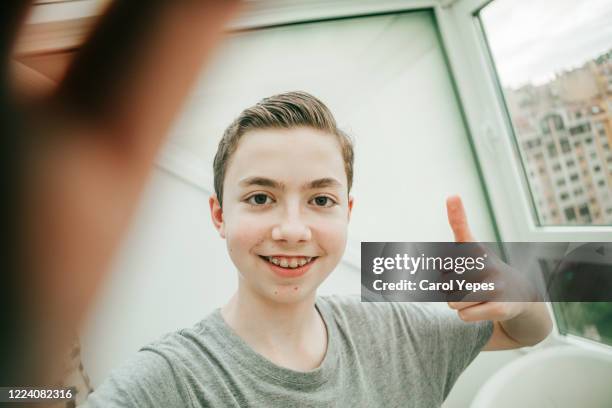 teenager boy making a selfie - modern boy hipster stock-fotos und bilder