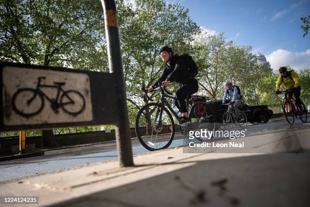 Commuters use the cycle lanes as they travel into London on May 11, 2020 in London, England. The prime minister announced the general contours of a...