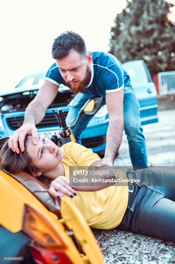 Male Trying To Check On Female Injured In Traffic Accident