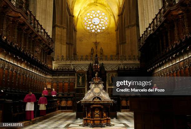 Priests conduct a mass at Seville cathedral on May 11, 2020 in Seville, Spain. Some parts of Spain have entered the so-called "Phase One" transition...