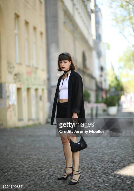 Lea Neumann wearing Aldo heels, Prada bag and complete H&M look on May 06, 2020 in Berlin, Germany.
