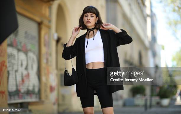Lea Neumann wearing Prada bag and complete H&M look on May 06, 2020 in Berlin, Germany.