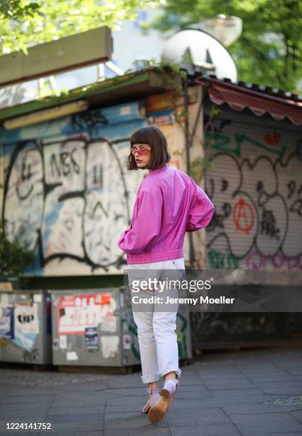 Lea Neumann wearing Levis jeans, essential Antwerp heels and Dior vintages shades on May 06, 2020 in Berlin, Germany.