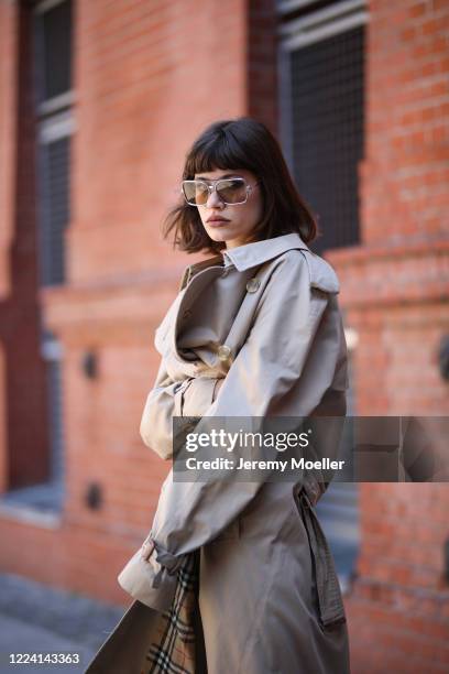 Lea Neumann wearing Burberry trenchcoat, Balenciaga Triple S and weekday pants and shirt on May 06, 2020 in Berlin, Germany.