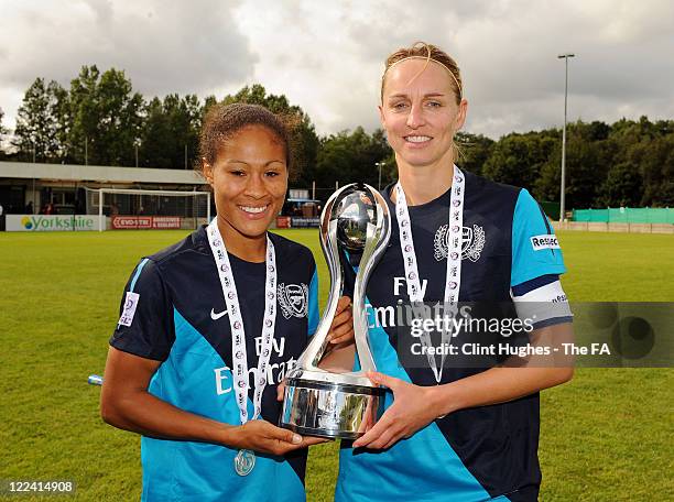 Faye White captain of Arsenal and her team-mate Rachel Yankey celebrate with the WSL trophy during the FA WSL match between Liverpool Ladies FC and...