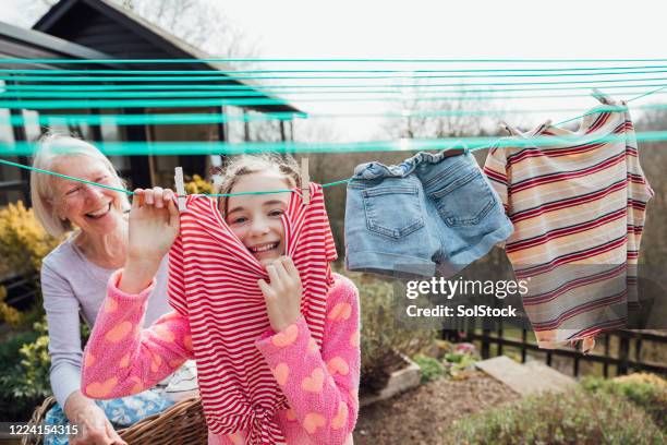 fun in the garden - clothesline stock pictures, royalty-free photos & images
