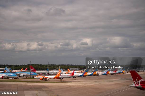 Grounded aircraft are seen at Manchester Airport on May 11, 2020 in Manchester, United Kingdom. The Prime Minister announced the general contours of...