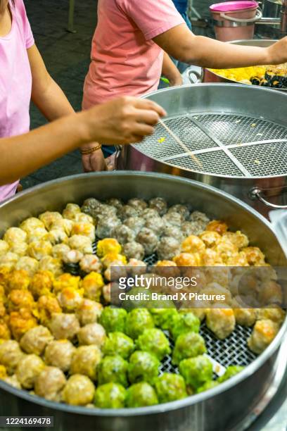 food being prepared in jalan alor street food market in kuala lumpur - traditional malay food stock pictures, royalty-free photos & images