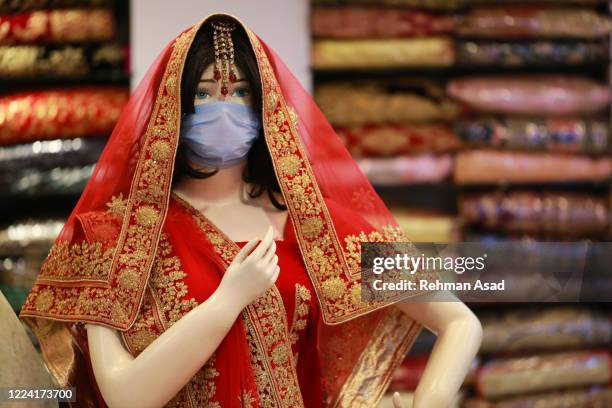 face mask wear on doll - bangladeshi wedding stock-fotos und bilder