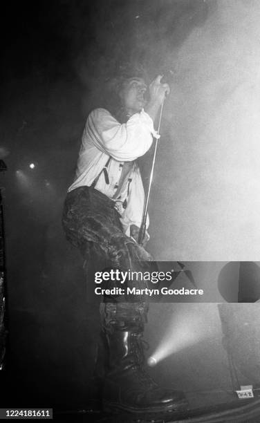 Carl McCoy of goth rock band Fields Of The Nephilim performs on stage, London, September 1990.