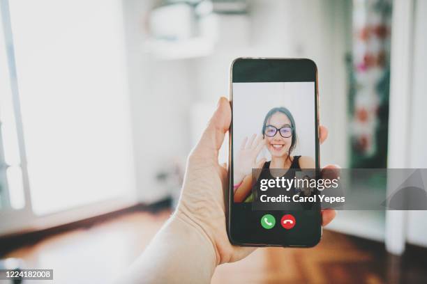 making video call with family - photophone fotografías e imágenes de stock