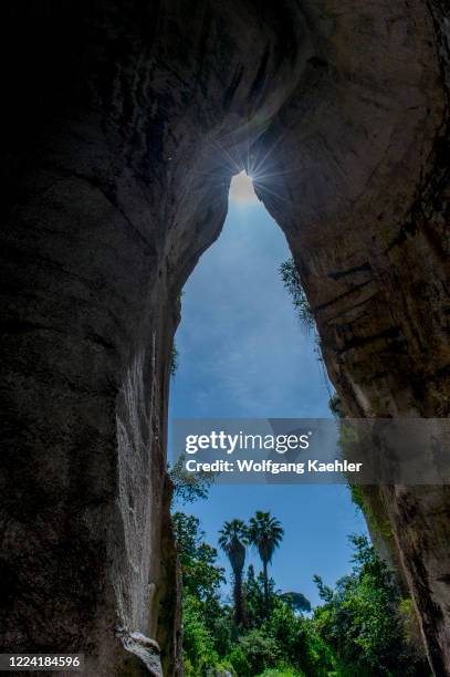 View out of the grotto or cavern known as L'Orecchio di Dionysio in the quarries at the Archeological Park in Syracuse on the island of Sicily in...