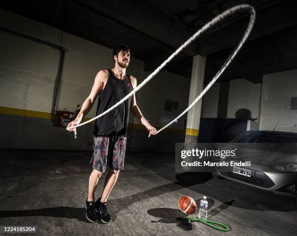 05m tall Argentine basketball player Kevin Hernandez trains in isolation in the garage of his building during coronavirus pandemic on May 09, 2020 in...