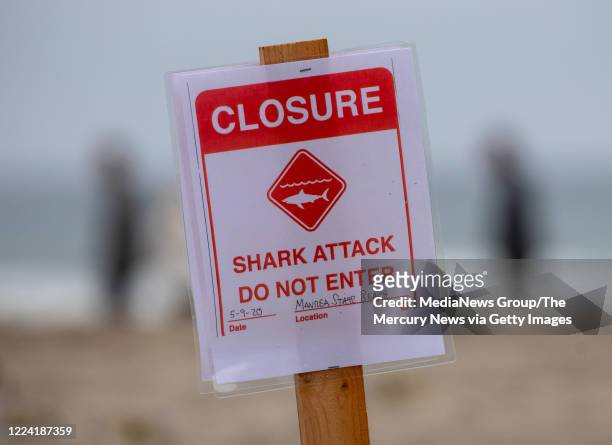 Shark attack sign is posted at the Sand Dollar Beach section of Manresa State Beach in Watsonville, Calif., after a surfer was killed by a shark...