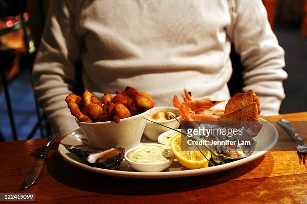 hot seafood platter - tasmania food stock pictures, royalty-free photos & images