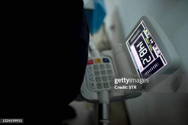In this picture taken on October 11 a scale shows the weight of a child during a weight loss program at a hospital in Beijing on October 11, 2011. A...