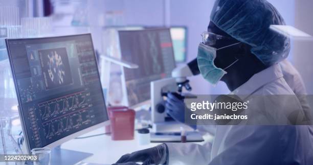 multi ethnic research team studying brainwave scanning. protective workwear - doctor and engineer stock pictures, royalty-free photos & images